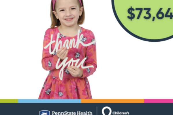 A young girl holds cutouts of the words "thank you." Other graphics on the screen include logos and the dollar figure $73,646.