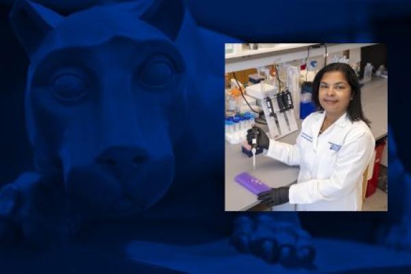 A photo of a woman wearing a white doctor's coat in a research lab